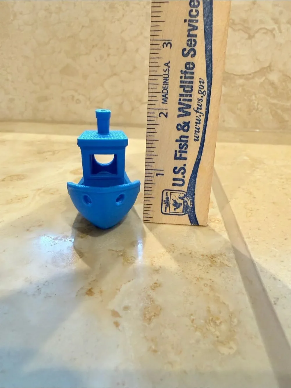 Small 3D-Printed Toy Boat in Bright Blue
